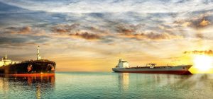 Two vessel at sea in sunset